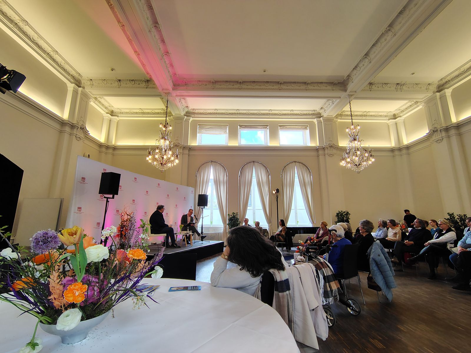 A salon at the Badischer Hof laid up for a spring reception, chandeliers and all