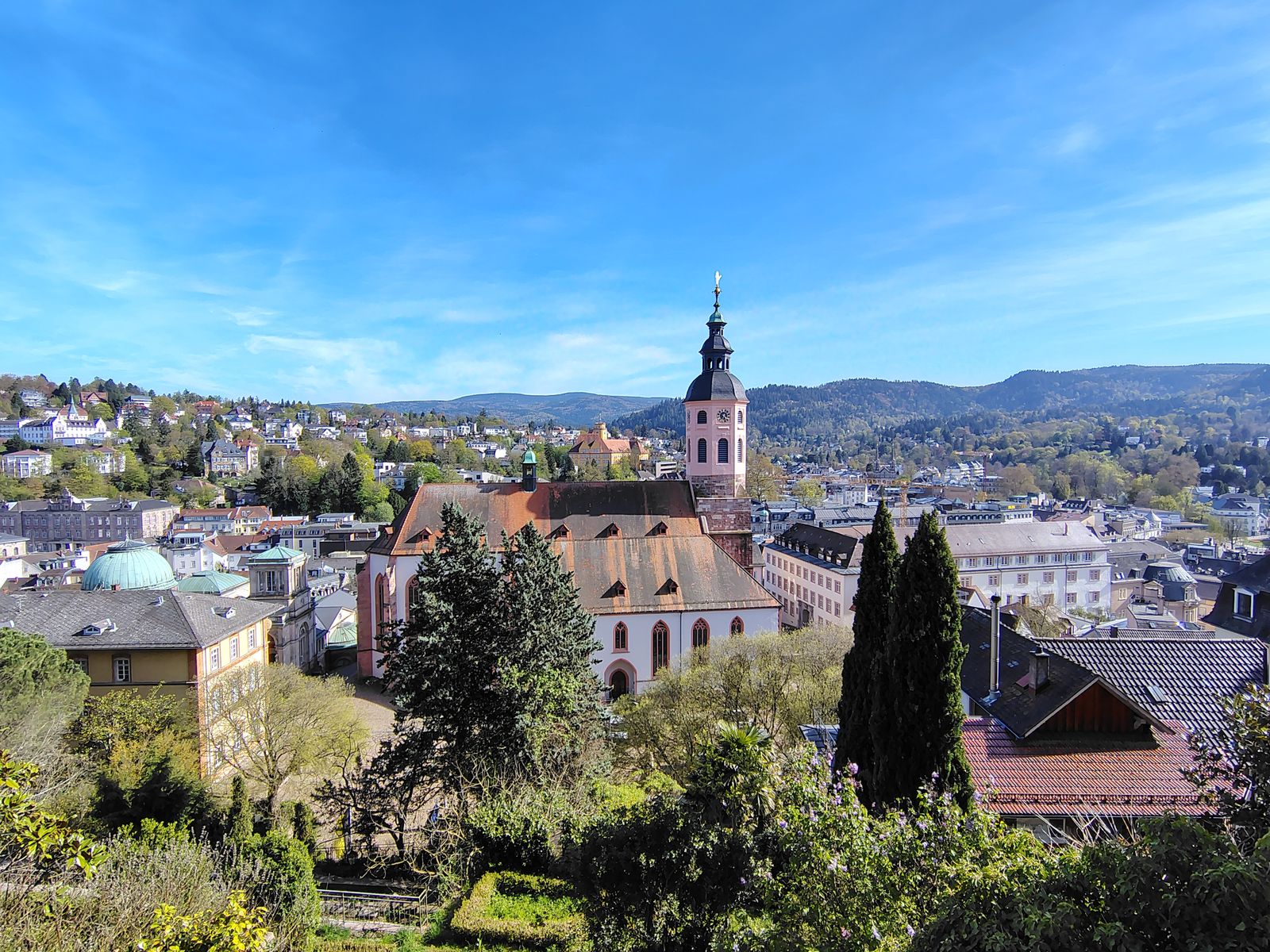 Baden-Baden in its valley, the collegiate church tower against the Black Forest hills