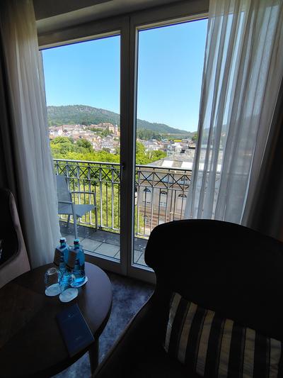A room with the town in the window — which is what the view costs you