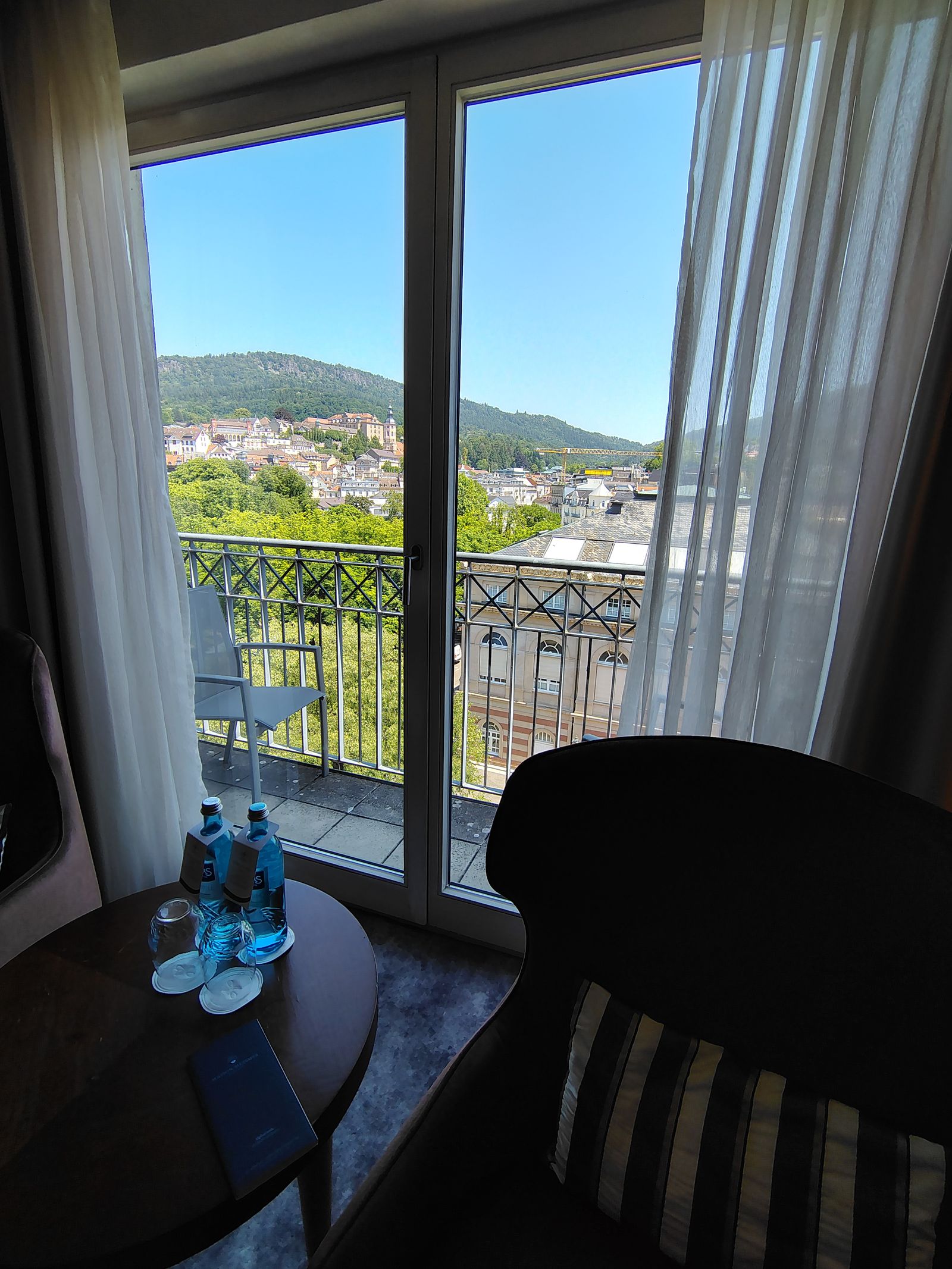 A room with the town in the window — which is what the view costs you