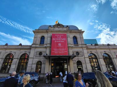 The Festspielhaus on an opera night, built behind the facade of the old railway station