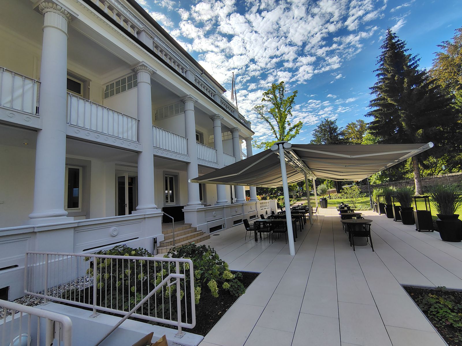 The Badischer Hof terrace under the pines, waiting for the evening