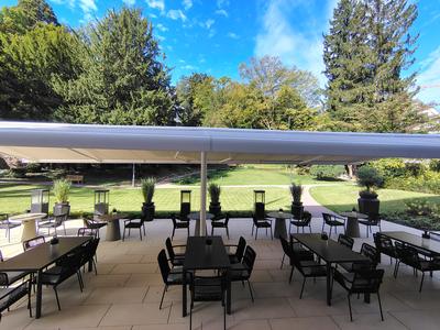 Badischer Hof terrace tables looking out onto the lawn