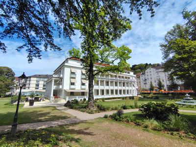 The Badischer Hof from under the plane trees in the park