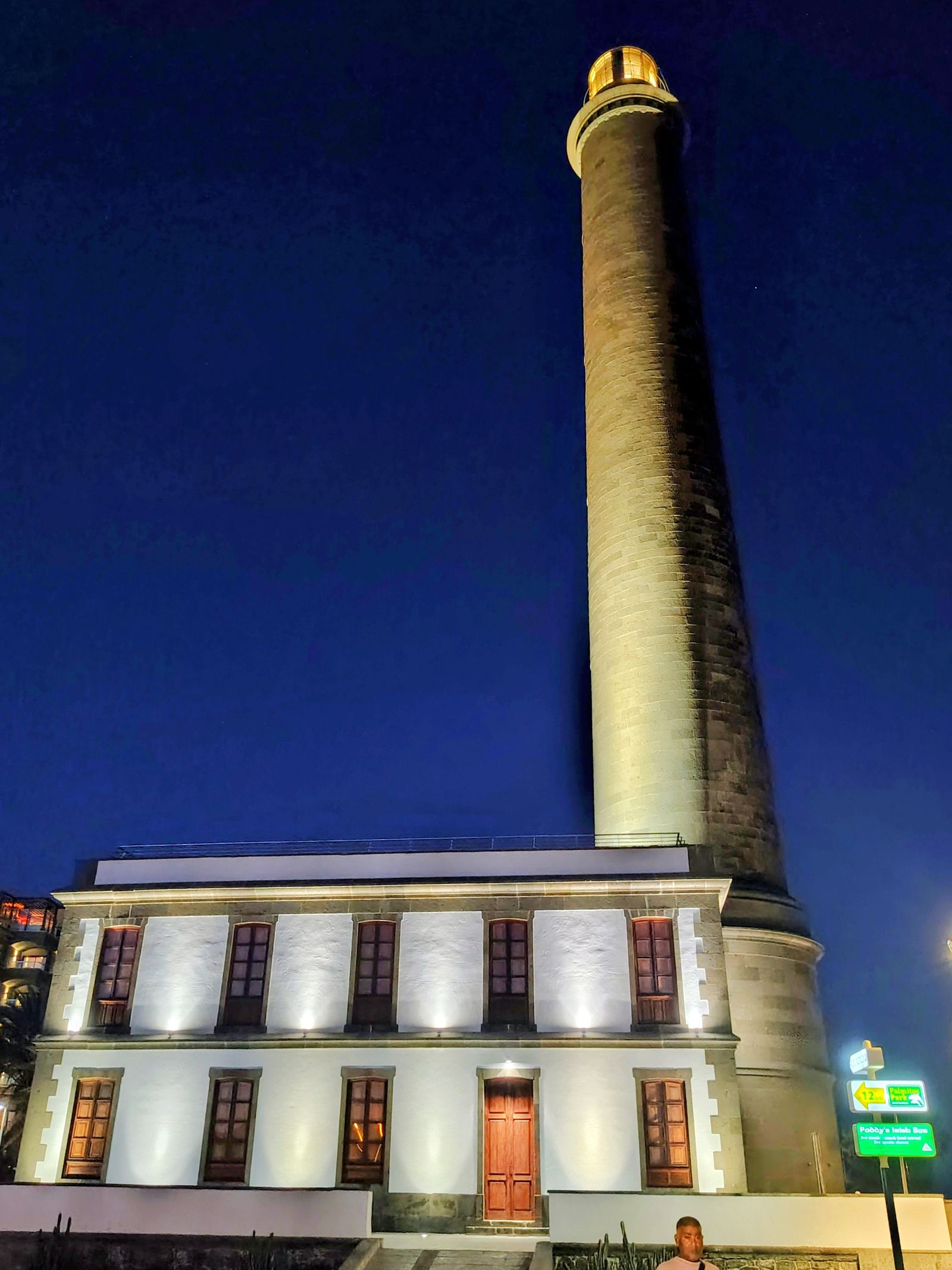 The Maspalomas lighthouse, 1890, floodlit against a blue hour sky