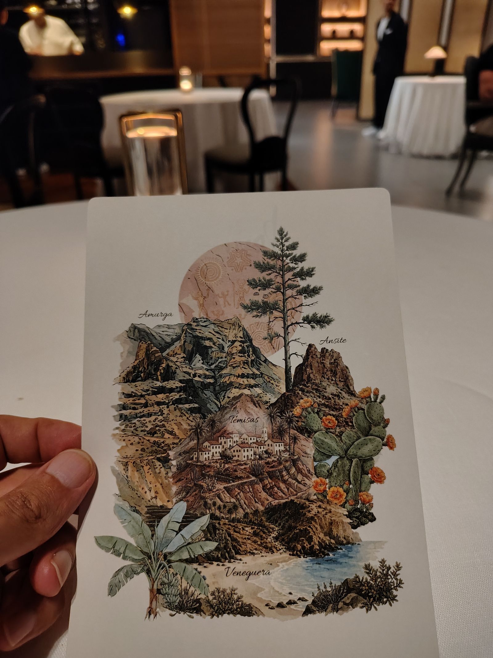A Lopesan dinner menu illustrated with the island's own landscapes