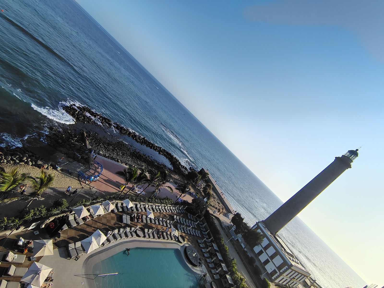 The Maspalomas lighthouse and the Lopesan pools from above, end of the day