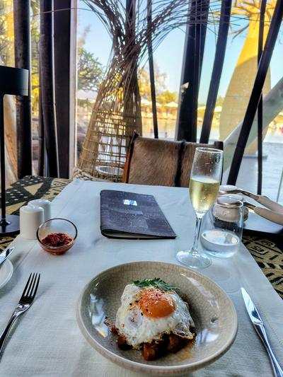 A table by the window at Lopesan as the light goes
