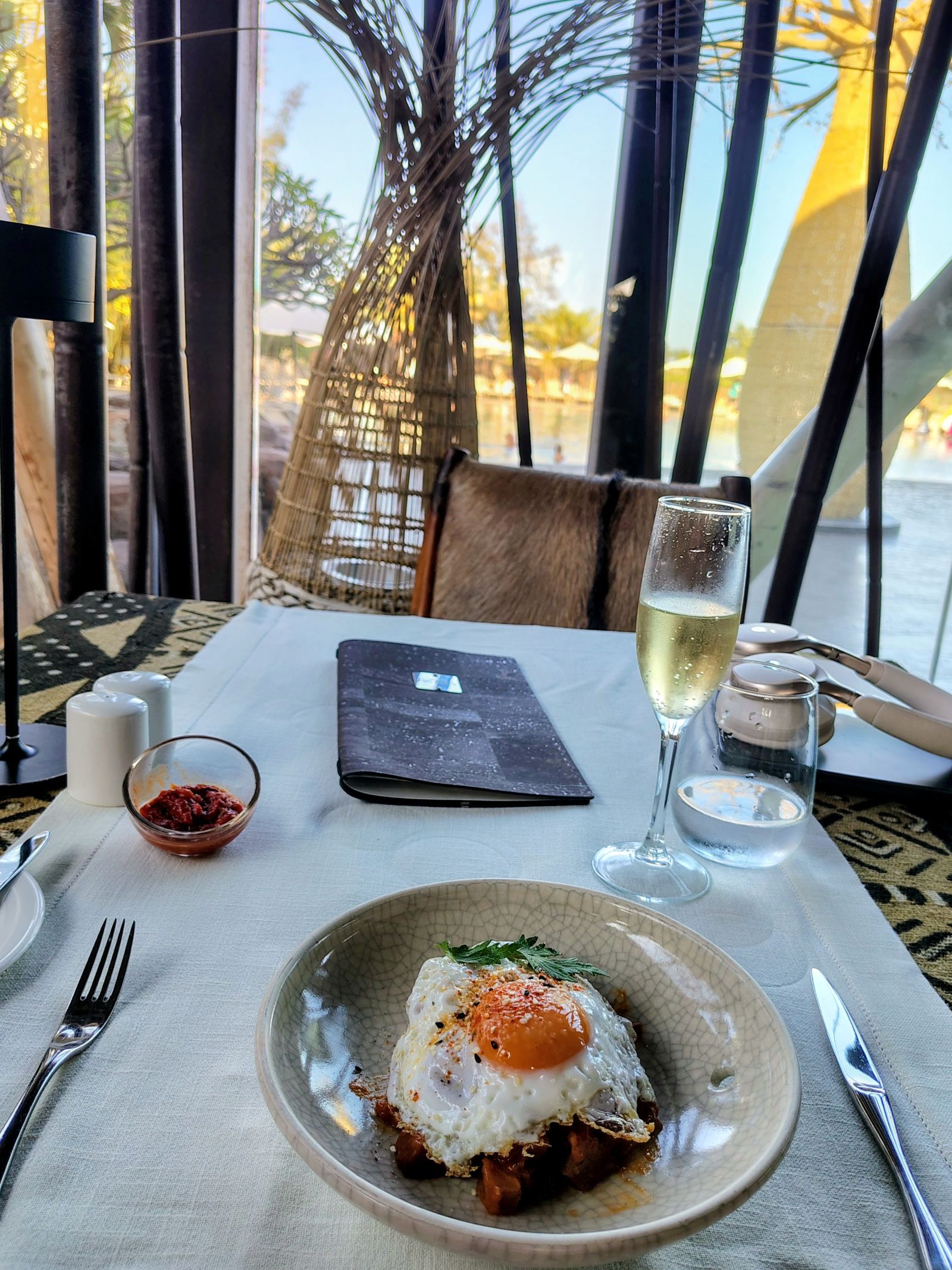 A table by the window at Lopesan as the light goes