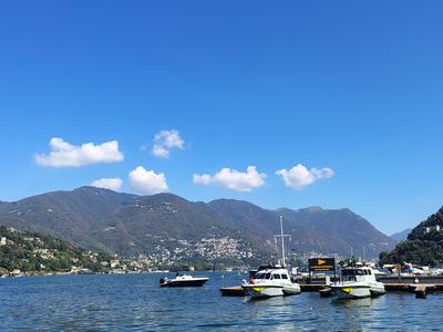 Boats at their moorings under the mountains, the lake opening out to the north