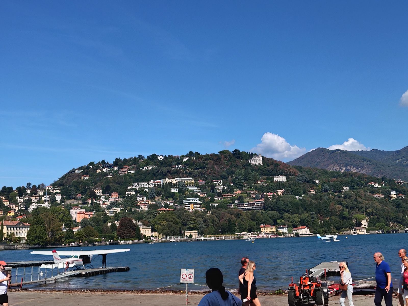 The far shore from the promenade, a seaplane on the water