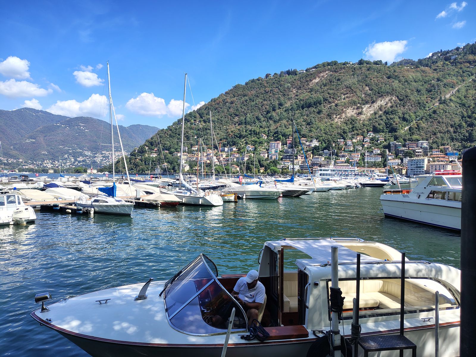 The marina, with the mountains folding down behind the masts