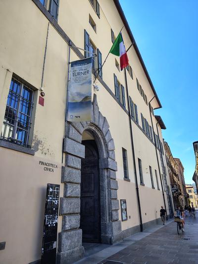 A civic building off the main square, flag out