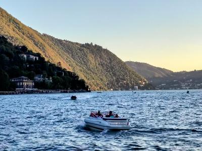 Golden hour on the water, a small boat heading home