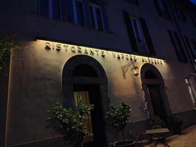 A village restaurant with its name cut into the stone — Lake Como