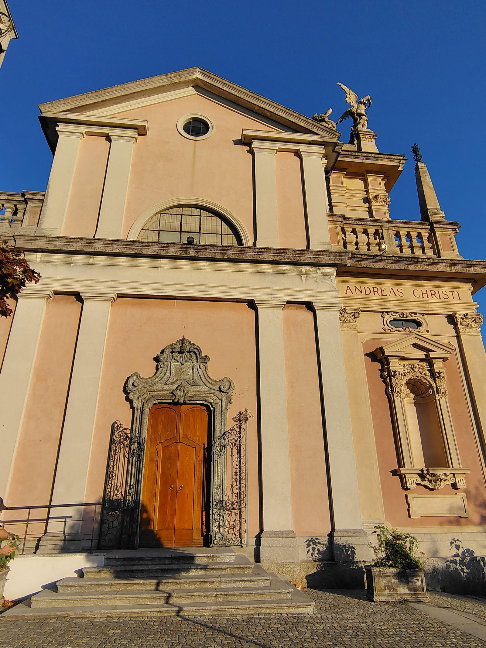 A pink church front catching the last of the sun
