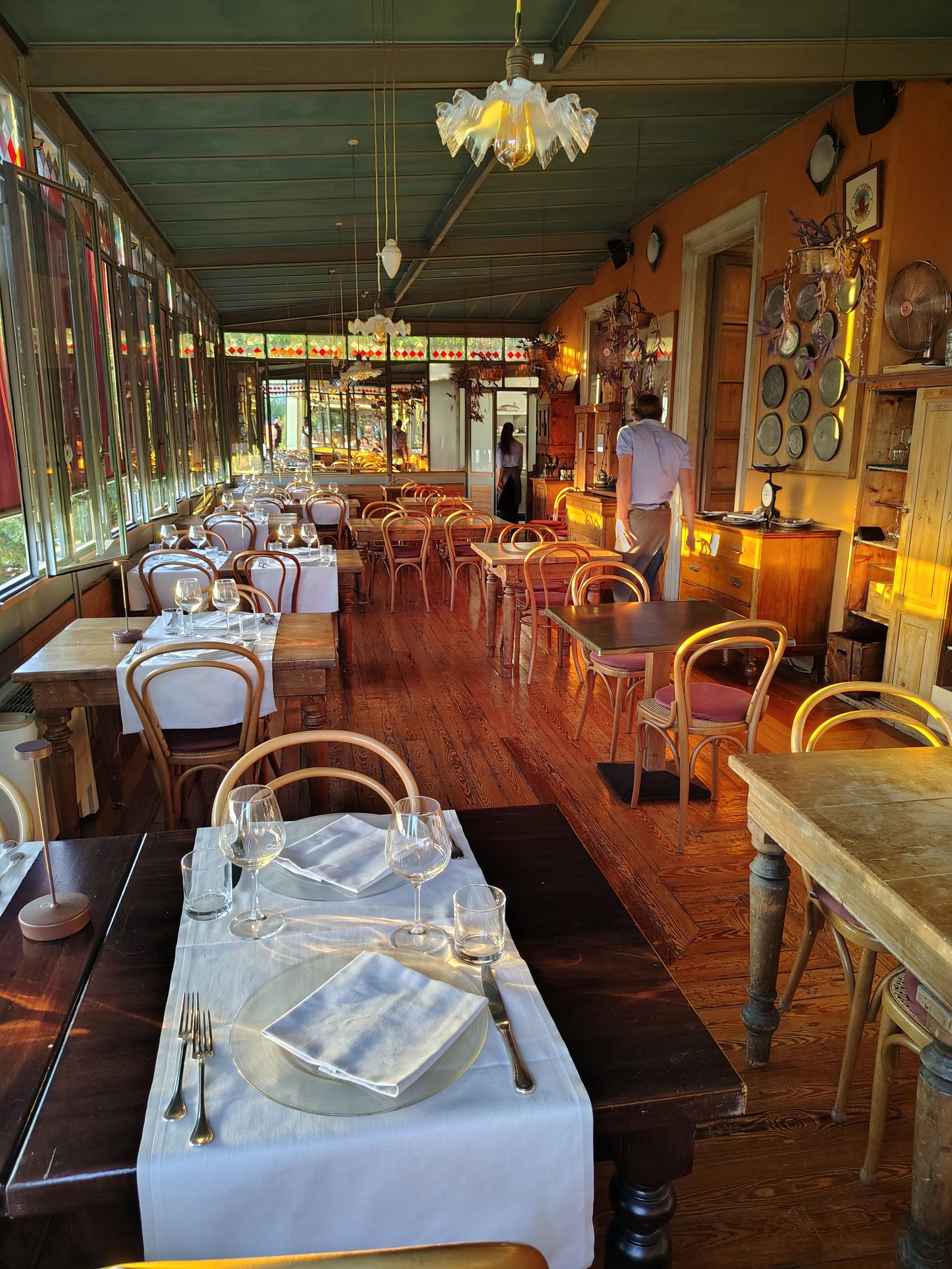 A dining room laid up and waiting, somewhere above the lake