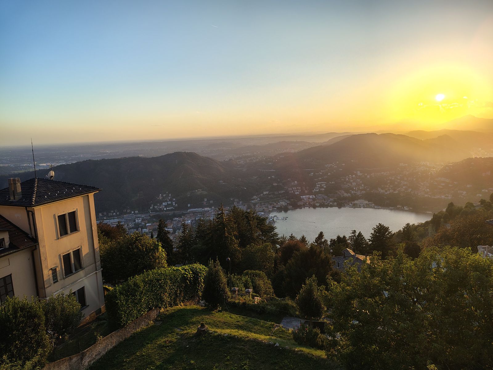 Sunset over the lake from a garden in the hills