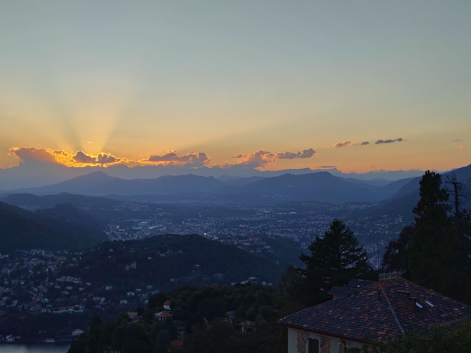 Last light over the Lombard plain, the lake already in shadow