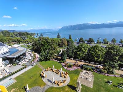 The Beau-Rivage Palace gardens from above, lake and Savoy Alps beyond