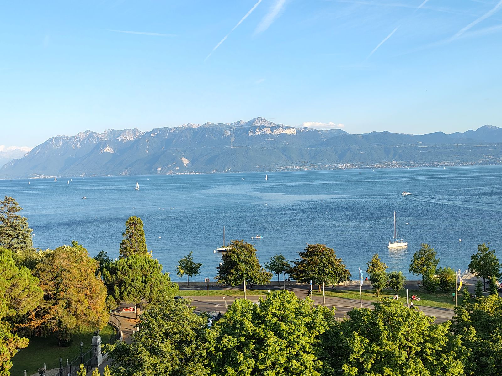 Sailing boats out on the lake in the long evening light