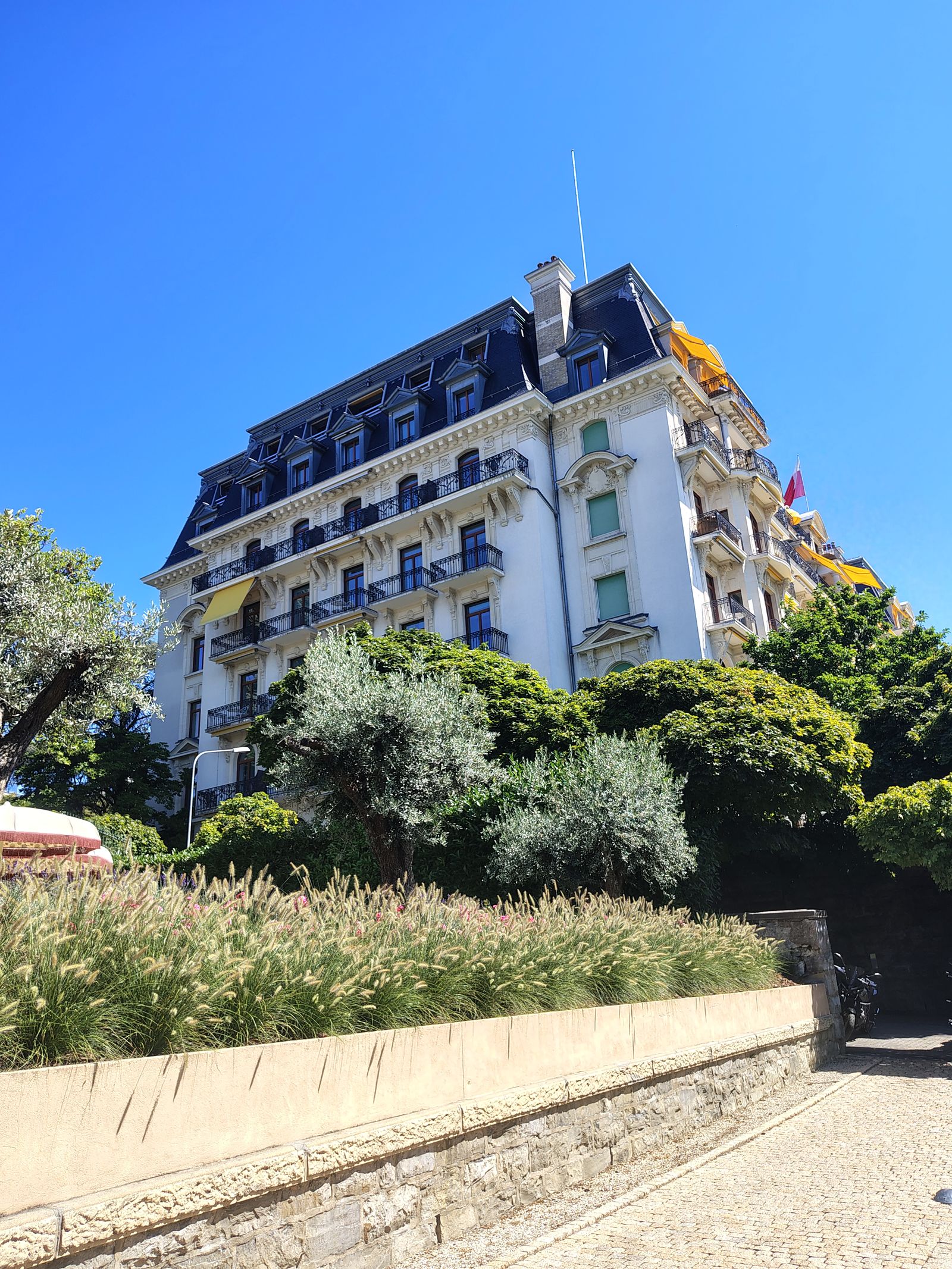 The Beau-Rivage Palace from the quay, every balcony facing the same way