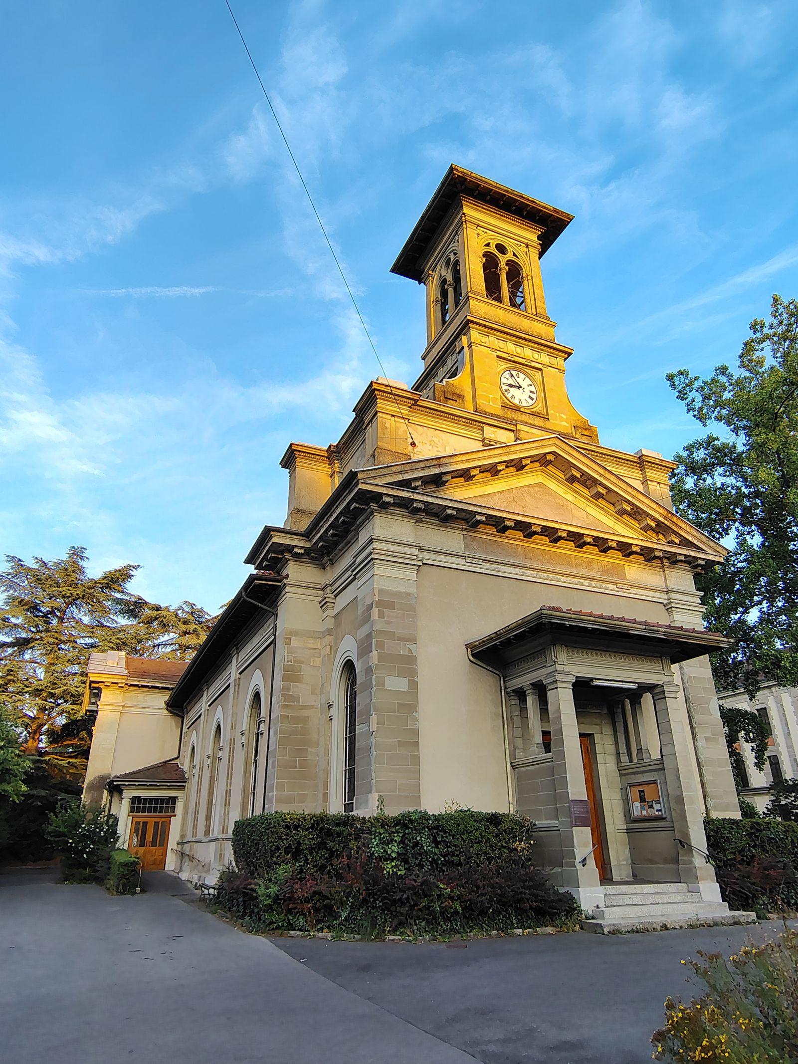 A small church lit against the dusk