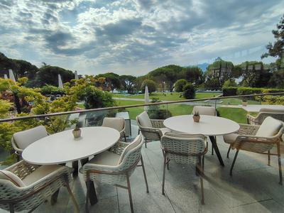Breakfast tables on the lawn at the Beau-Rivage Palace, nine in the morning