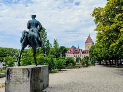 The equestrian statue in the Beau-Rivage Palace park, the Château d'Ouchy behind it