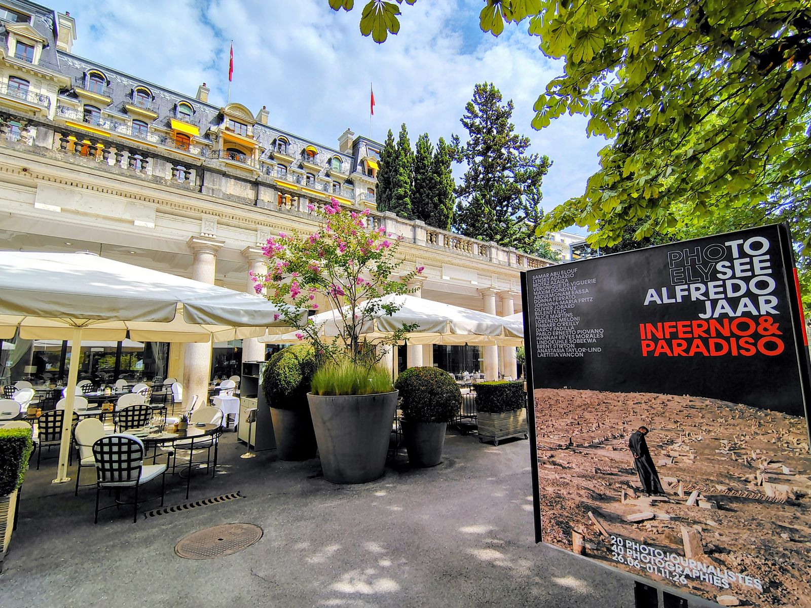 The Beau-Rivage terrace, and a poster for the Alfredo Jaar show at Plateforme 10