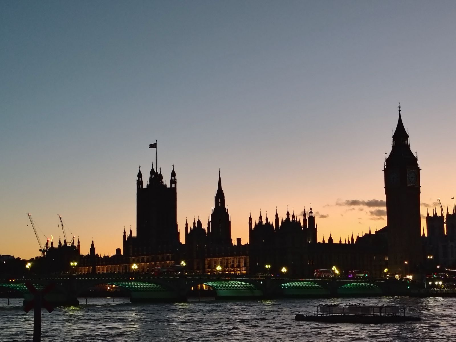 The Houses of Parliament against an October sunset, seen from across the Thames