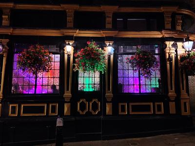 The lit windows of an old London pub near Temple