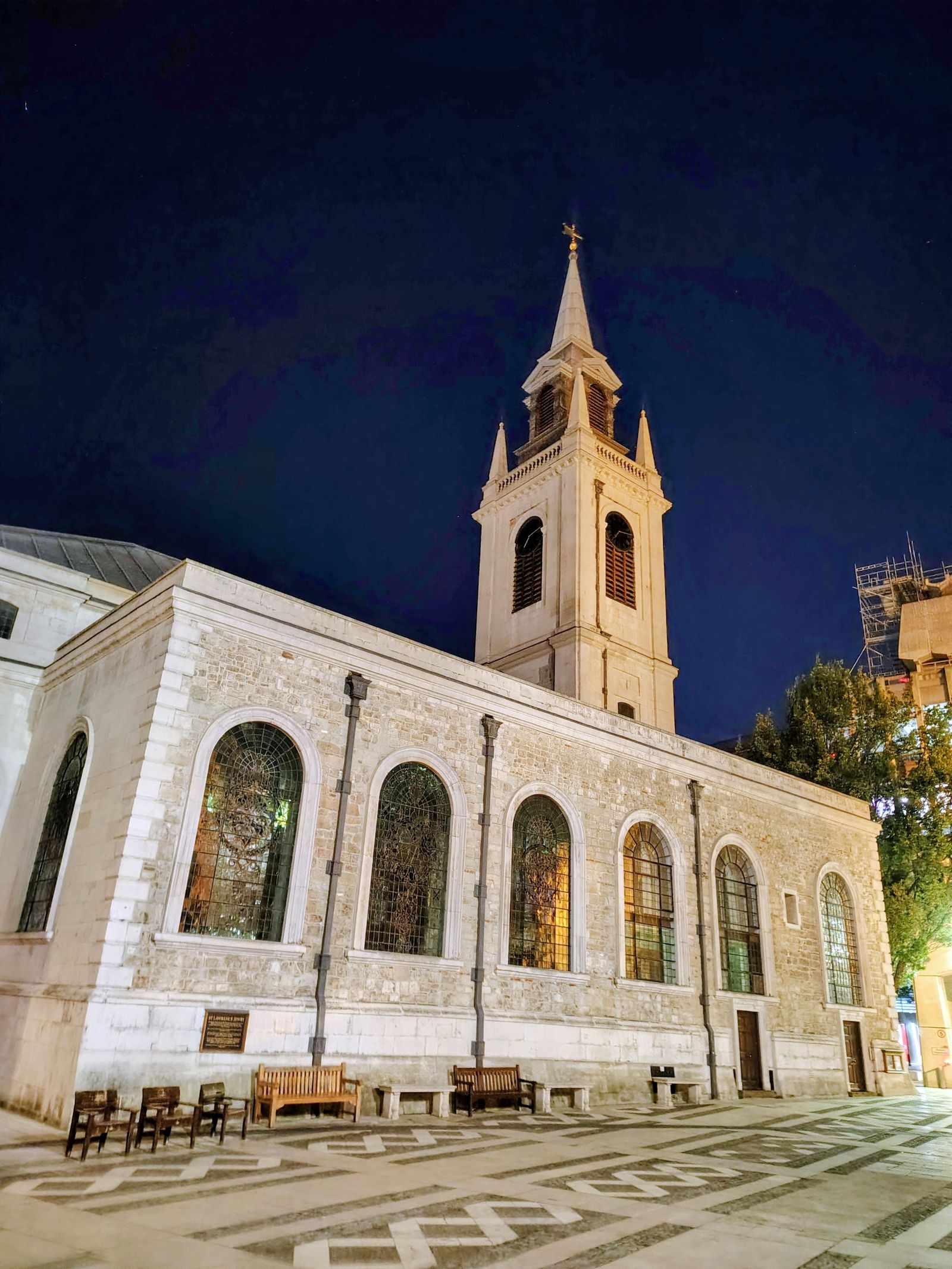 A City church floodlit at night, a few streets from St Paul's
