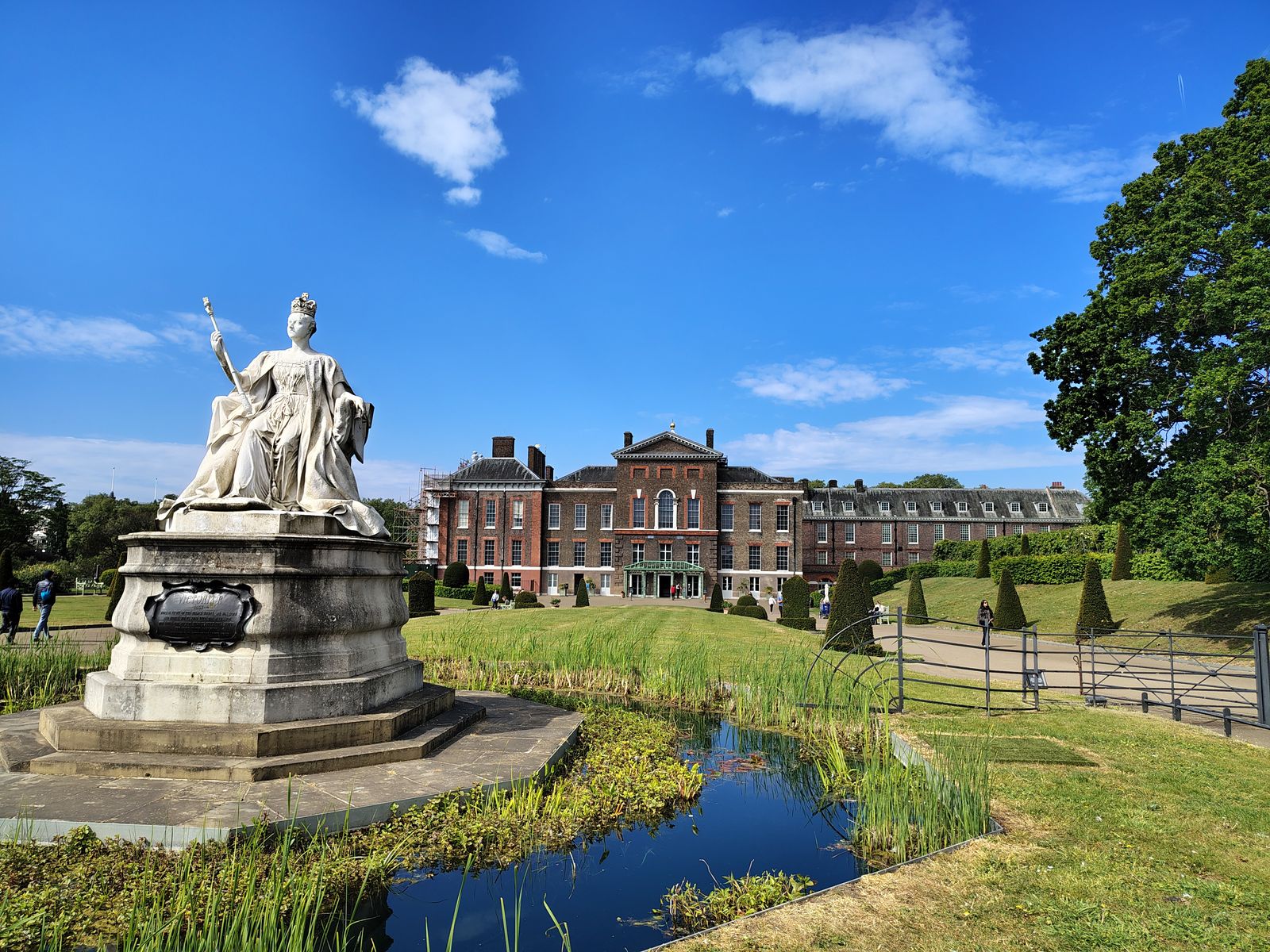 Queen Victoria's statue in front of Kensington Palace on a summer morning