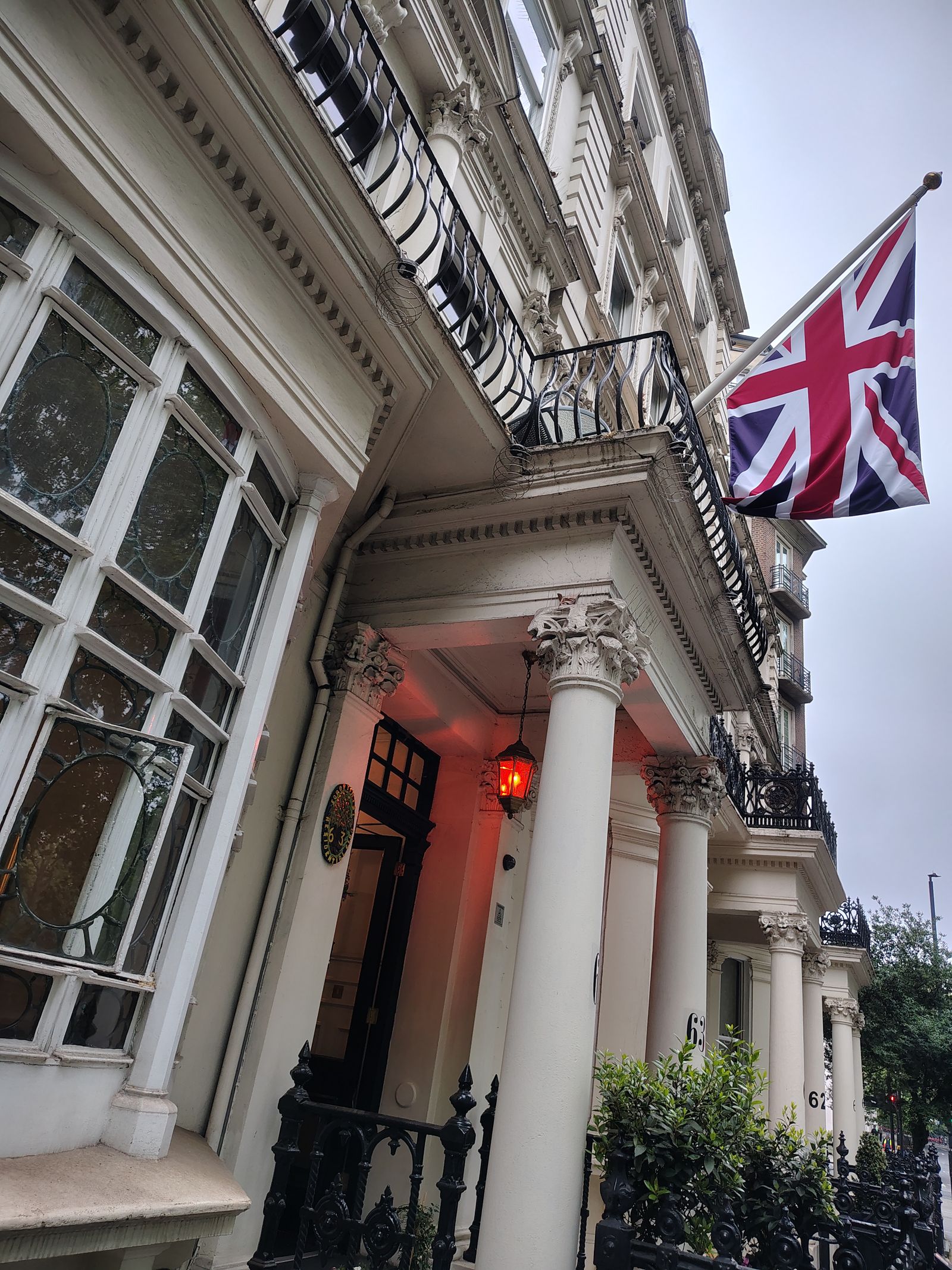 A porticoed Bayswater entrance with the Union flag out
