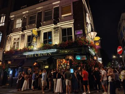 The Crown on Brewer Street at closing time, Soho doing what Soho does — London