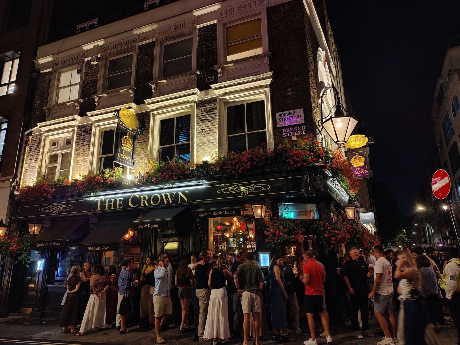 The Crown on Brewer Street at closing time, Soho doing what Soho does — London