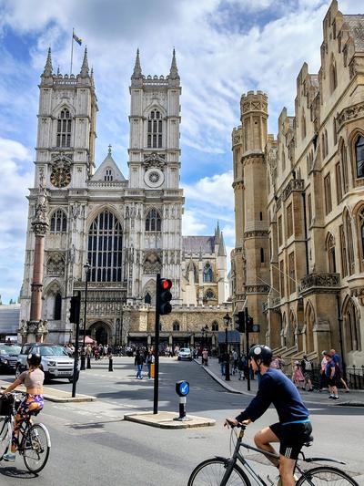 Westminster Abbey on a Saturday, cyclists waiting at the lights