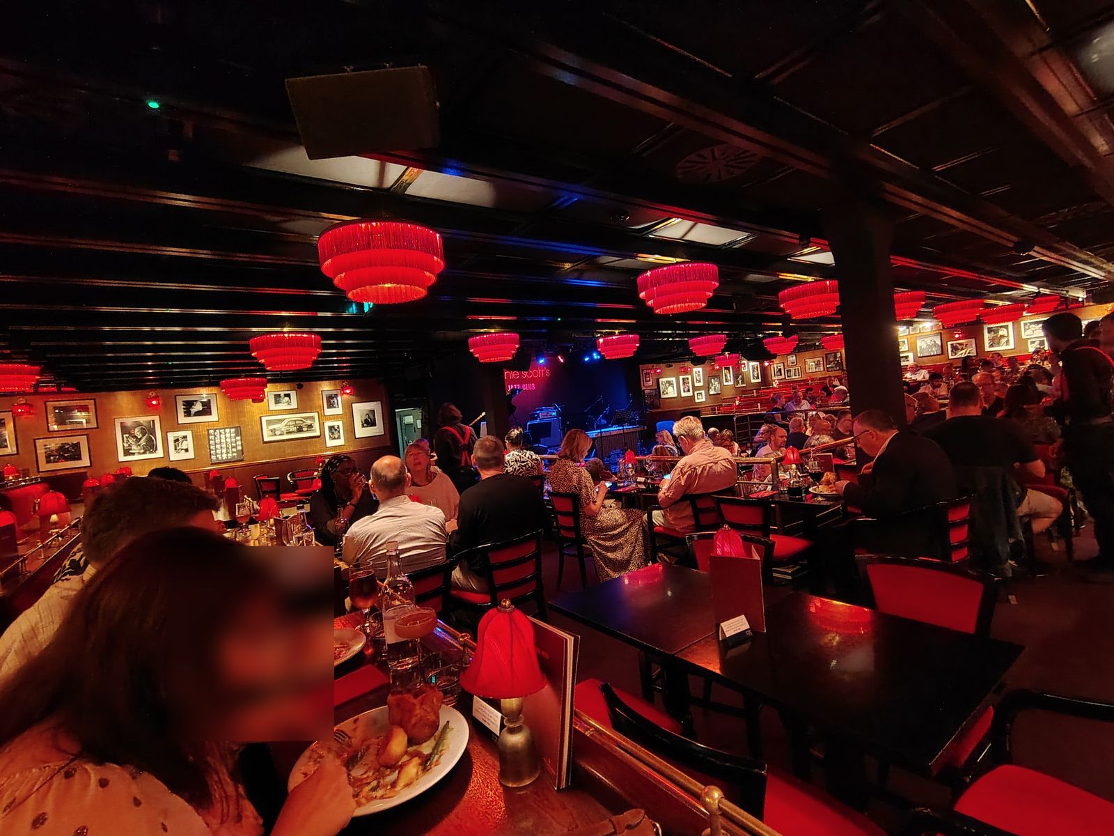 Sunday lunch at Ronnie Scott's on Frith Street, the red lamps lit and the band about to start