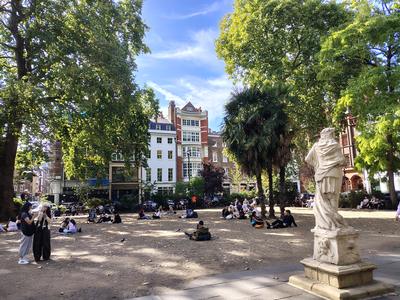 Soho Square on a warm afternoon, the statue of Charles II among the loungers <strong>Our own photograph of London, not of the hotel.</strong>
