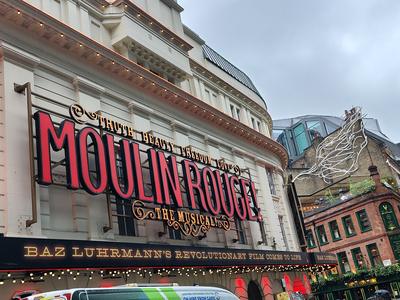 Moulin Rouge in lights over the Piccadilly Theatre