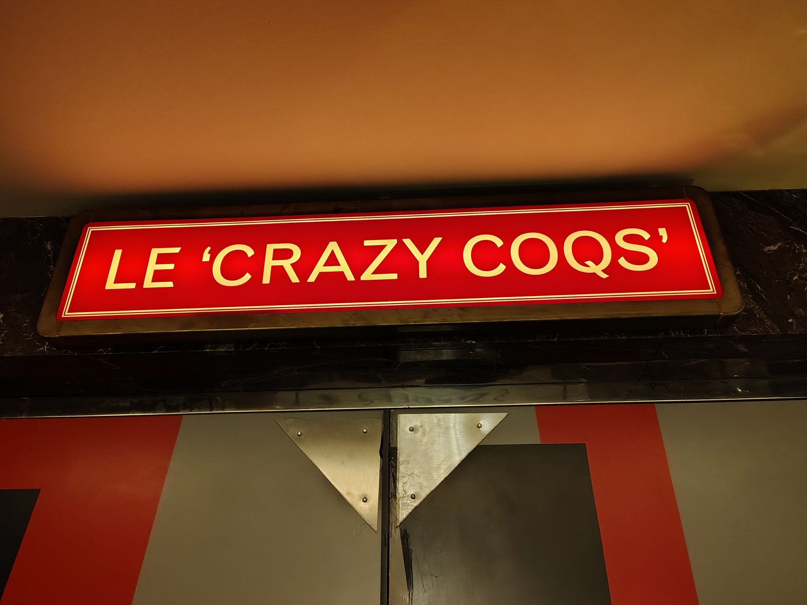 The sign over the door of Crazy Coqs, the cabaret room beneath Brasserie Zédel