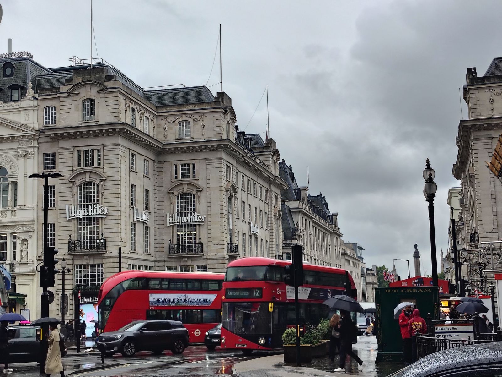 Piccadilly Circus in the rain, which is when the buses look their best — London