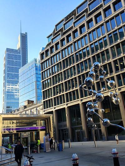 The Elizabeth line entrance at Liverpool Street, the City towers rising behind
