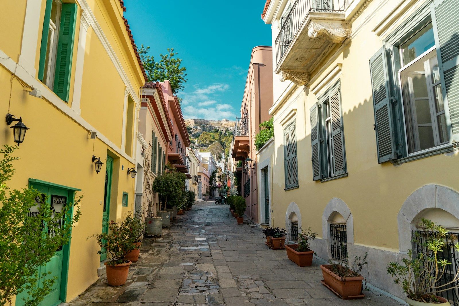 A lane below the Acropolis rock, pots on every step. Photo: Matt Cramblett on Unsplash
