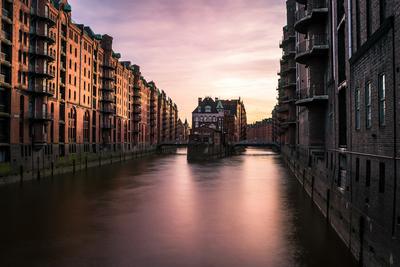 The Wasserschloss where two Speicherstadt canals meet, at dusk — Hamburg