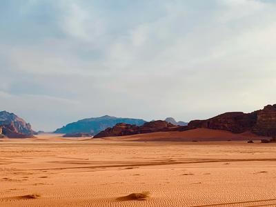 Red sand running out to the horizon — Jordan
