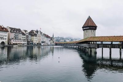 The town along the water under a soft sky — Lucerne
