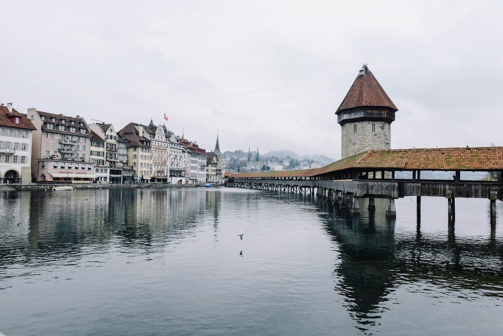 The town along the water under a soft sky — Lucerne