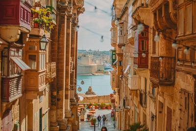 A Valletta street of traditional wooden balconies — Malta